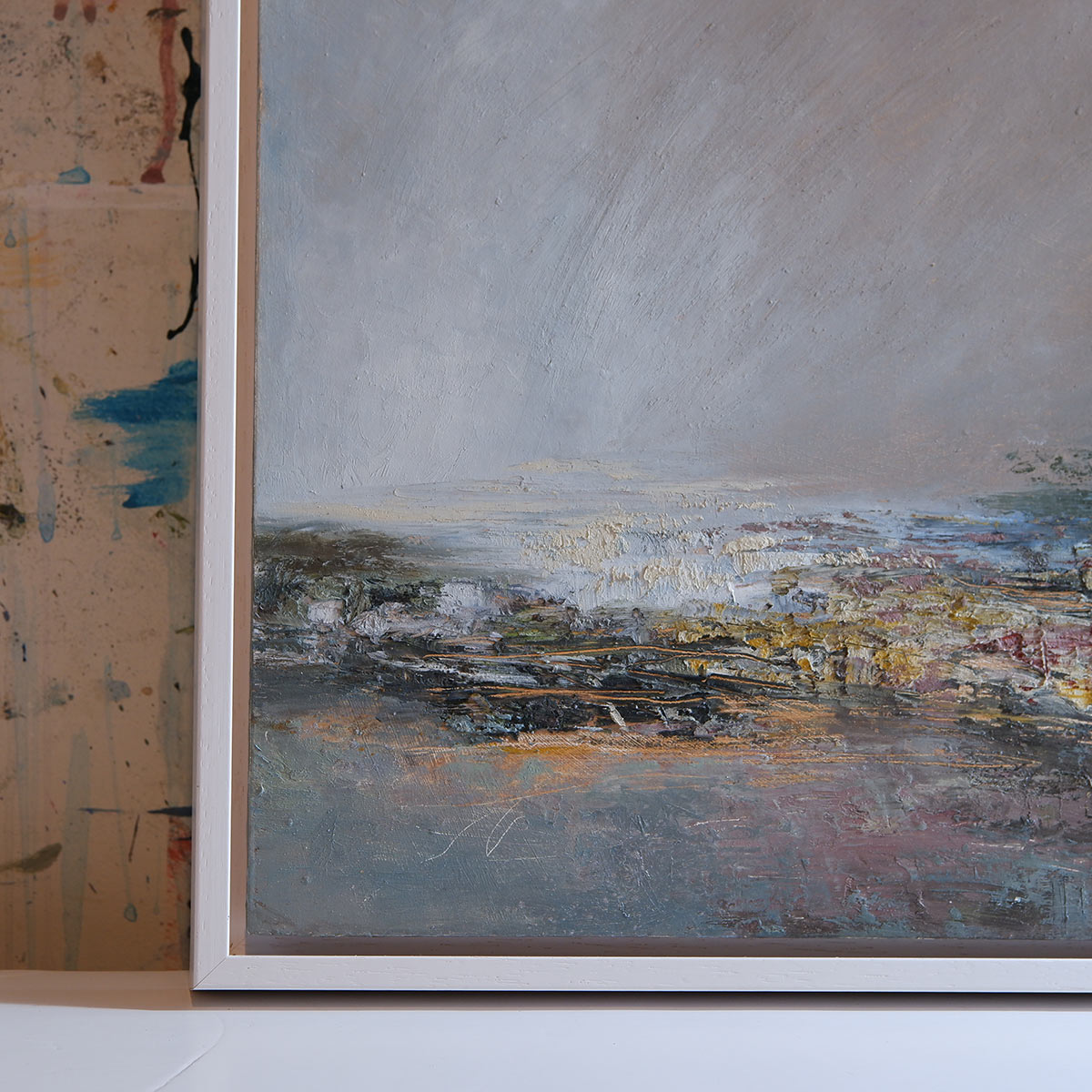 close up of lefthand corner with white floating frame showing textures and layers. Gold underneath showing through