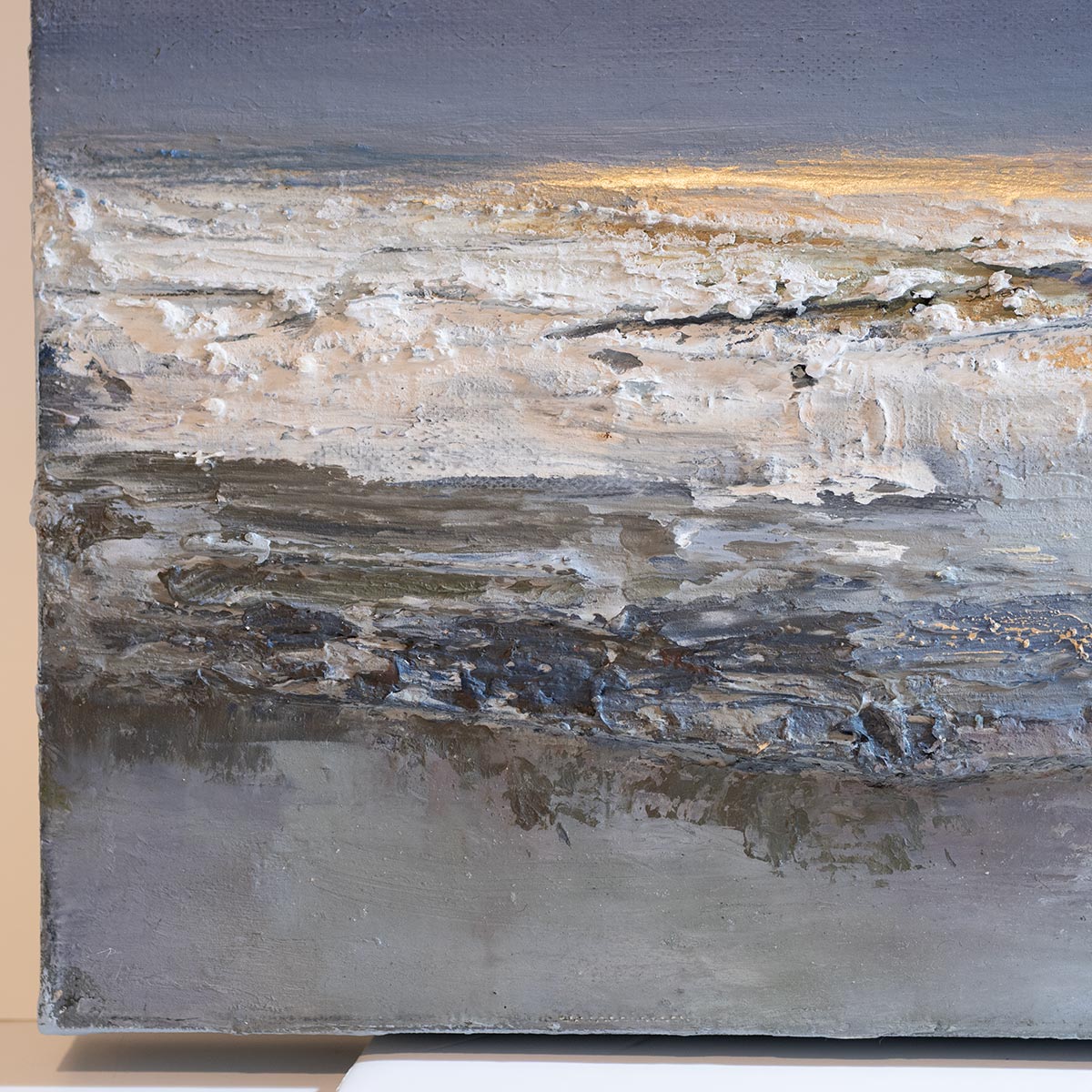 close up of left hand edge of highly textured canvas