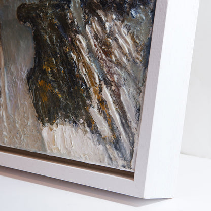 Close-up of an abstract painting with a white frame on a light background